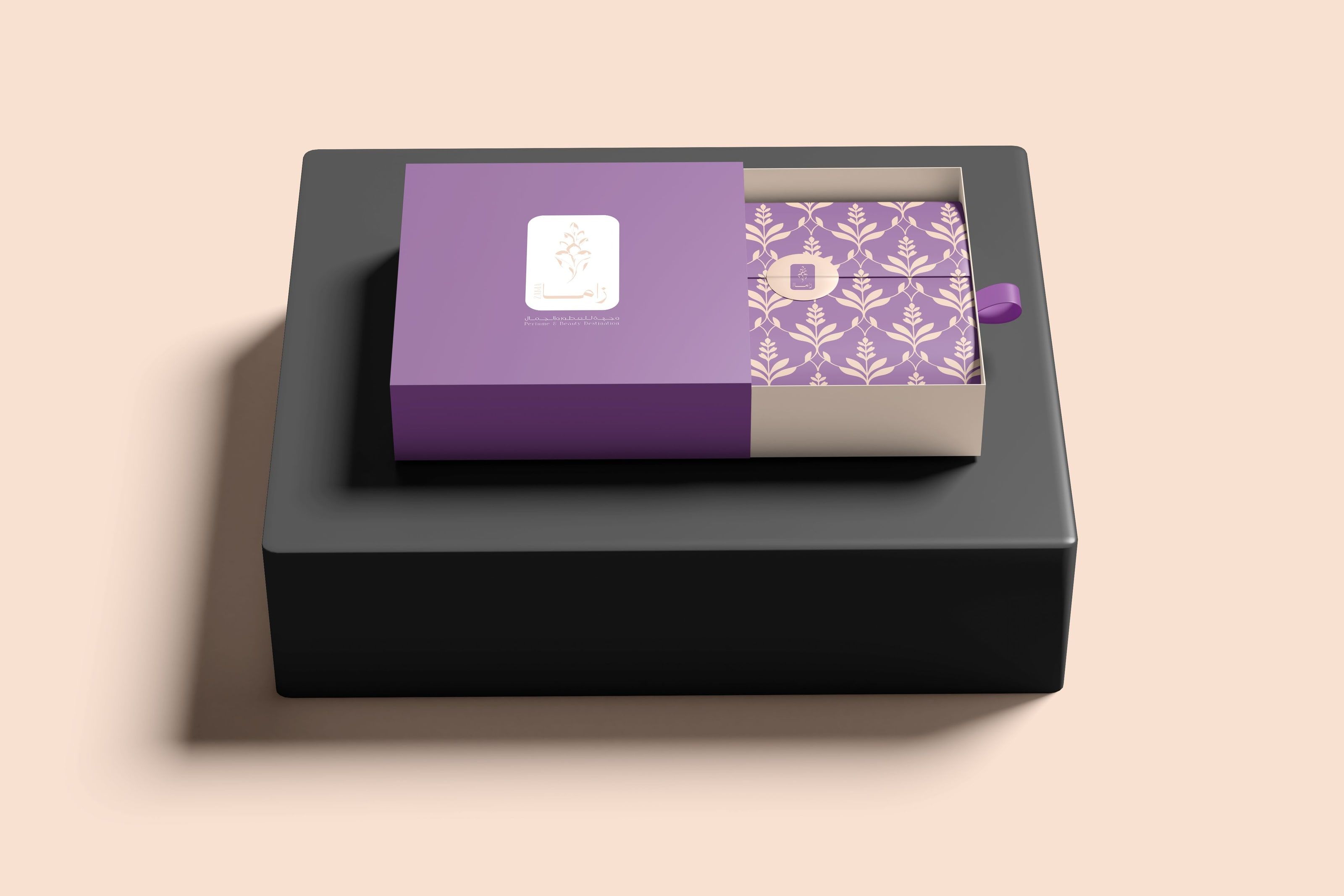 The Zama drawer gift box: a purple sleeve slid open over lavender-lattice tissue and a peach seal